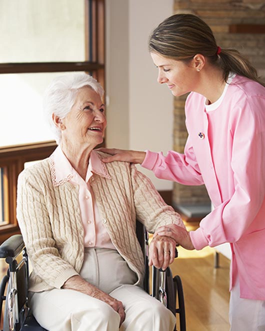Nurse with elderly client in a wheelchair