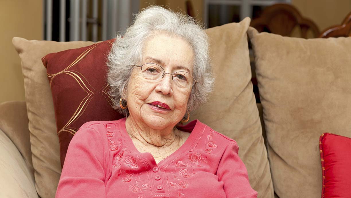 elderly client sitting on sofa