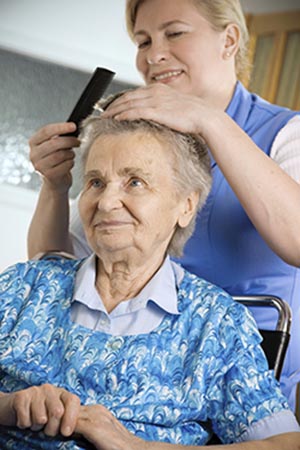 caregiver assisting elderly client